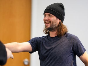 Scott Crandall working in a dance studio.