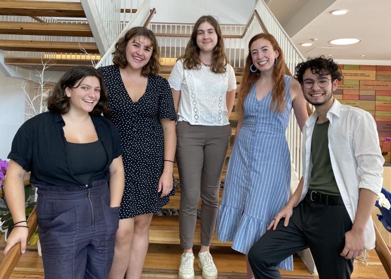 Five Oberlin students pose on a staircase