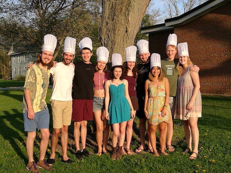 Groups of students wearing chef hats