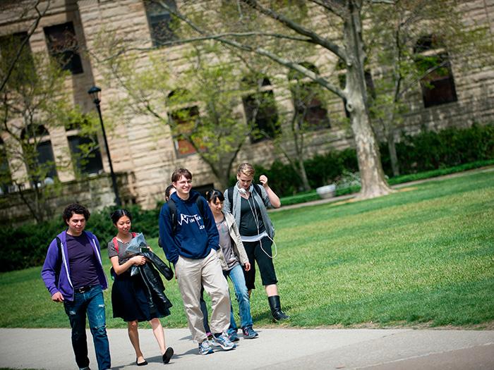 A group of students walking together on campus.