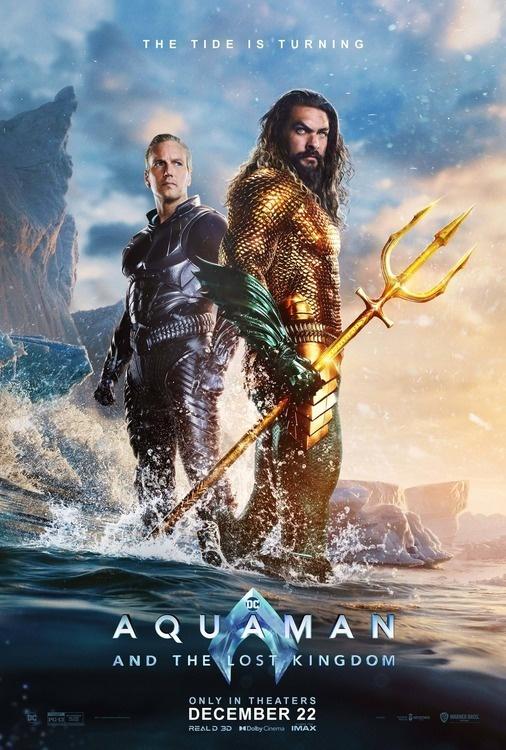 Aquaman movie poster featuring two lead actors standing in splashing waves