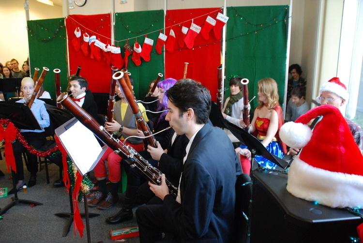 Bassoonists performing in Christmas holiday attire