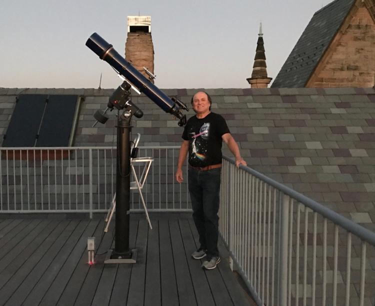 Dave Lengyel on a roof with telescope