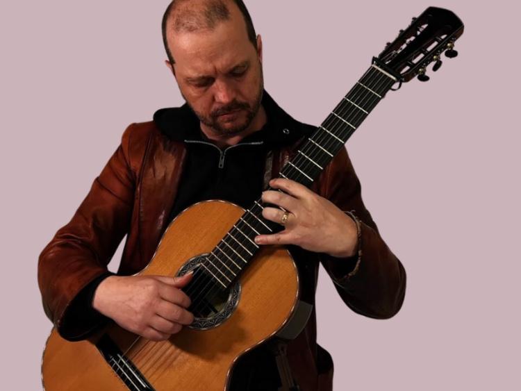 Alan Mearns performing on classical guitar