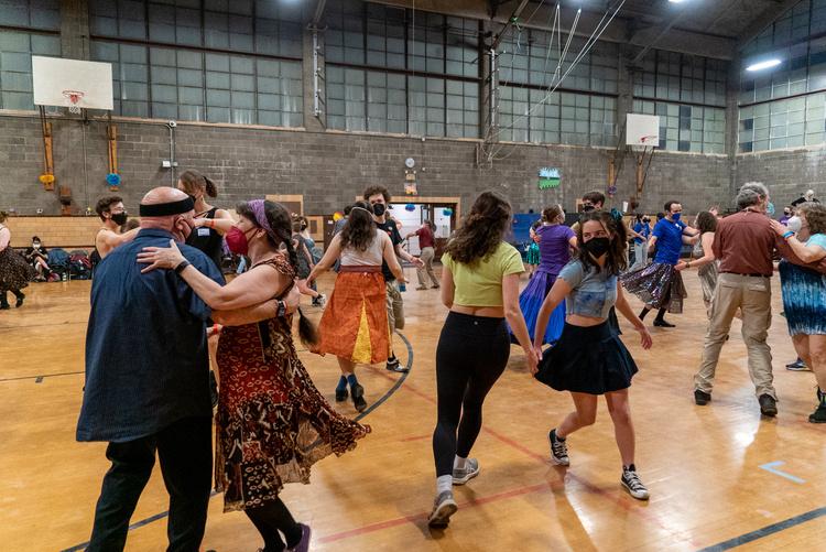 Attendees of past Contra Dance dancing in Hales Gym