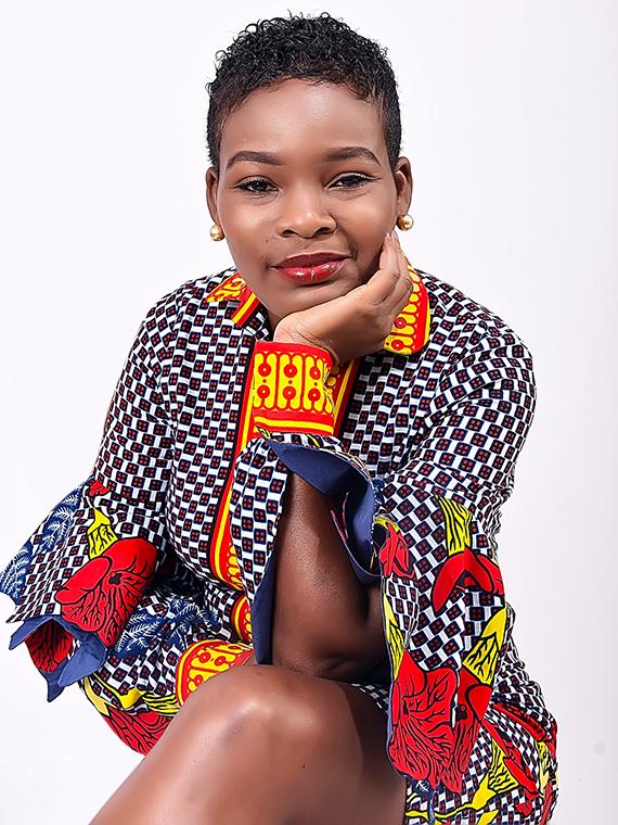 Woman smiling with hand on face.