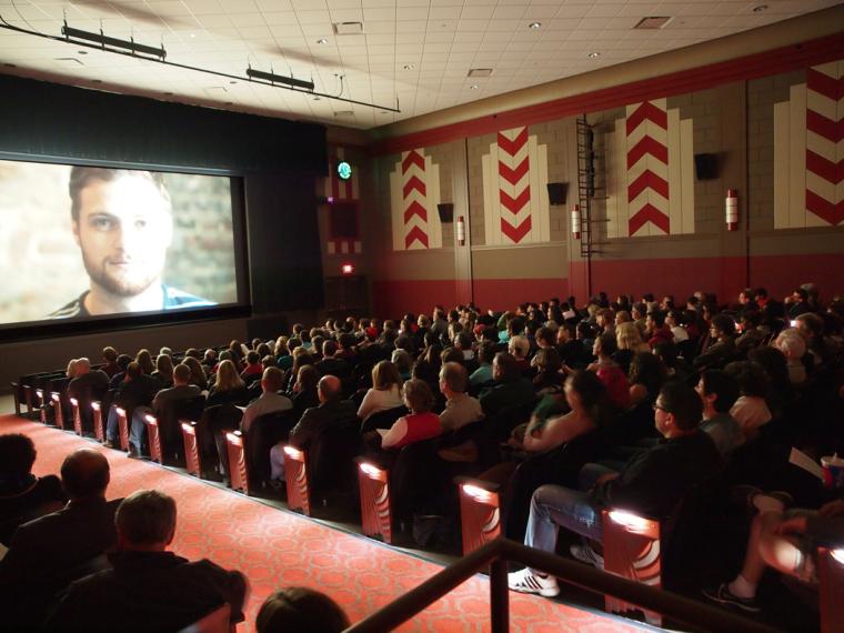 Audience watching a movie in the Apollo Theater