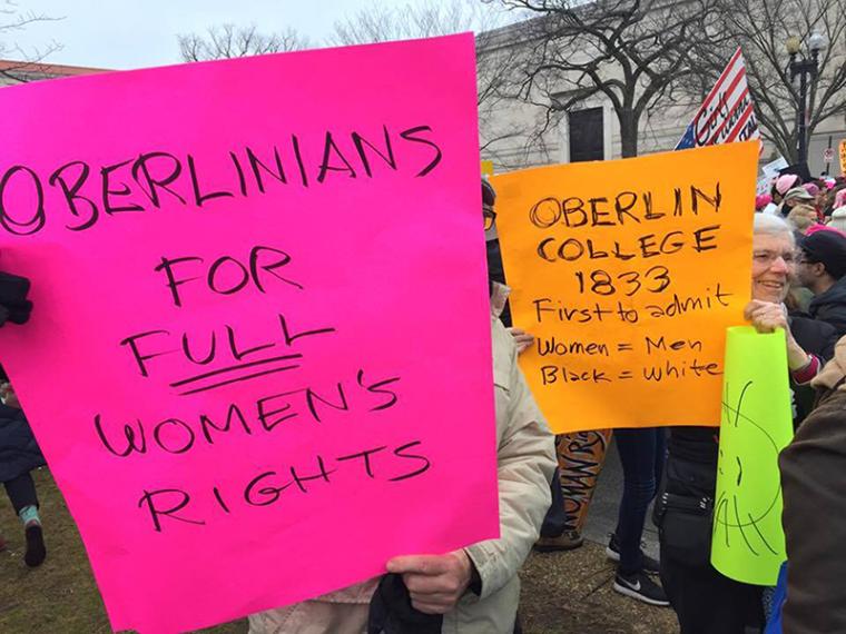 people holding posters at the Women's March in Washington, D.C