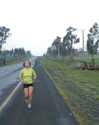 Joanna Johnson ’11 running along an asphalt path.