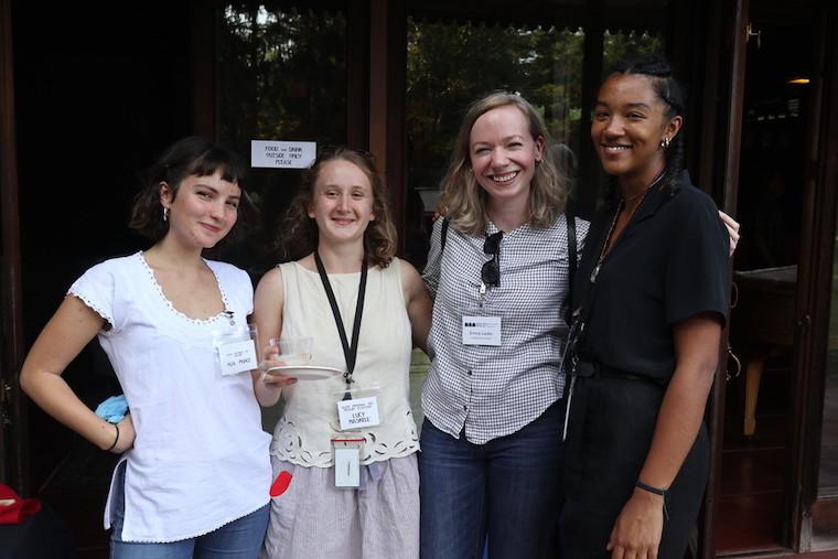 Four students standing side by side