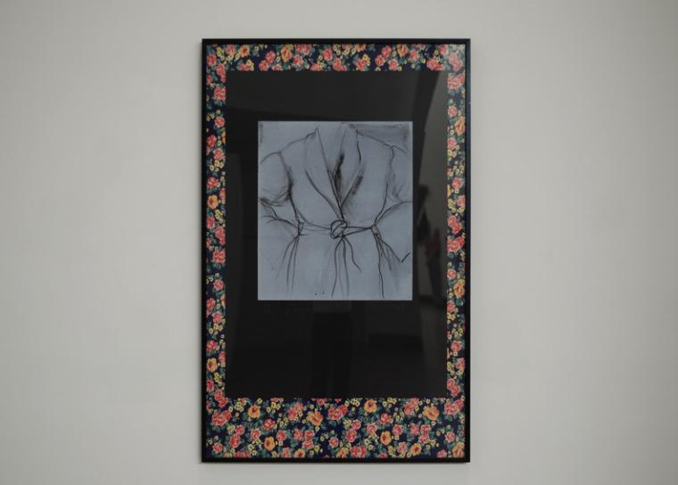 Framed fabric on display