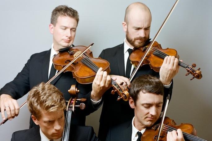 Calder Quartet playing violins