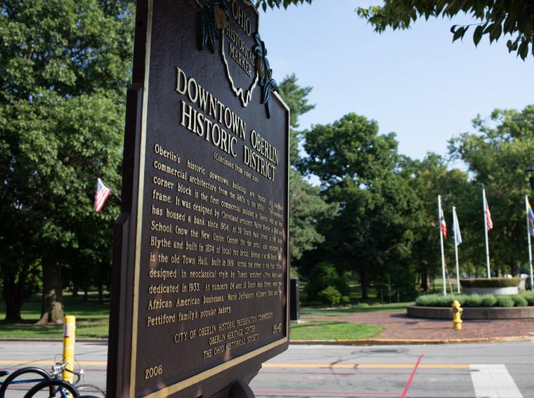 Bronze sign recognizing downtown Oberlin as a historic district