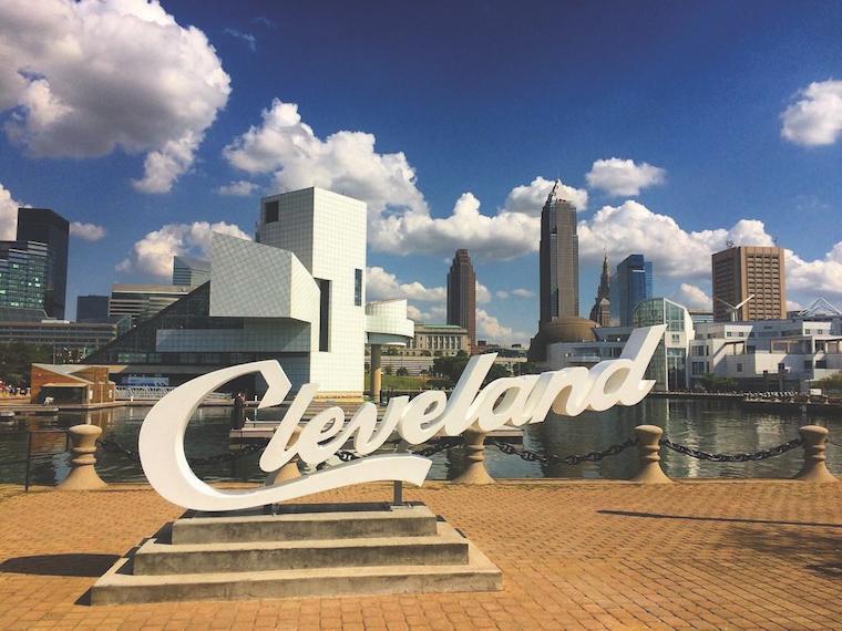 Cleveland script sign on brick platform.