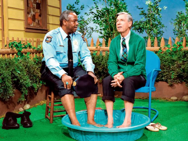 Rogers and Clemmons with their feet in a pool.