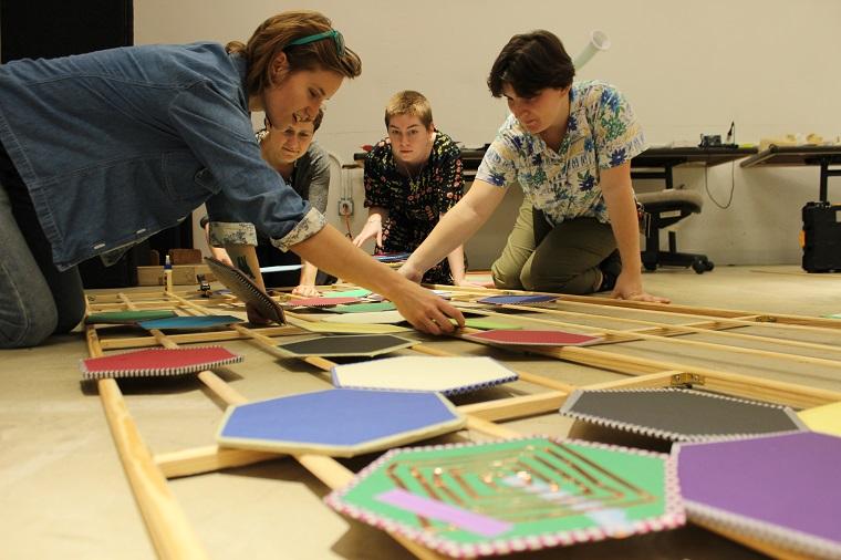 students working on "What I Didn't Say" installation