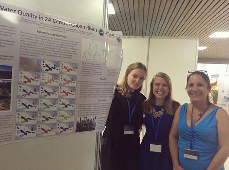 From left: Monica Dix ’20, Mae Kate Campbell ’17,  Rita Sibello Hernandez in front of research poster