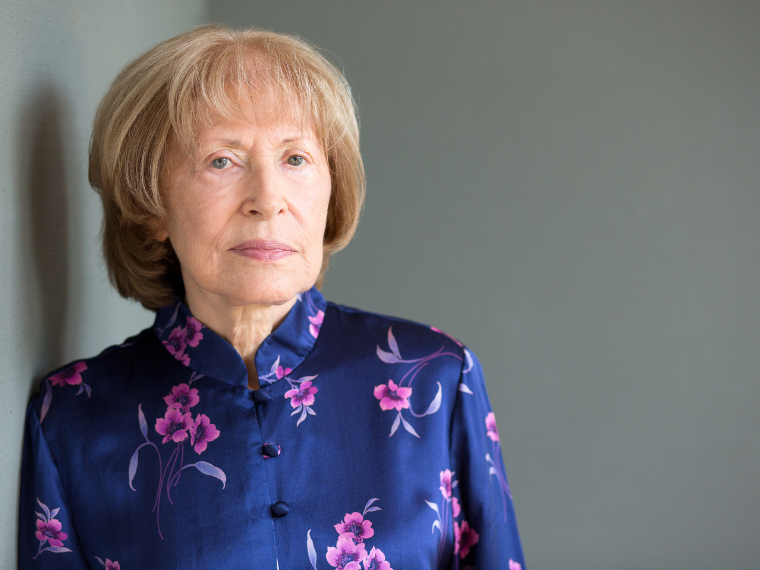 woman posing against wall
