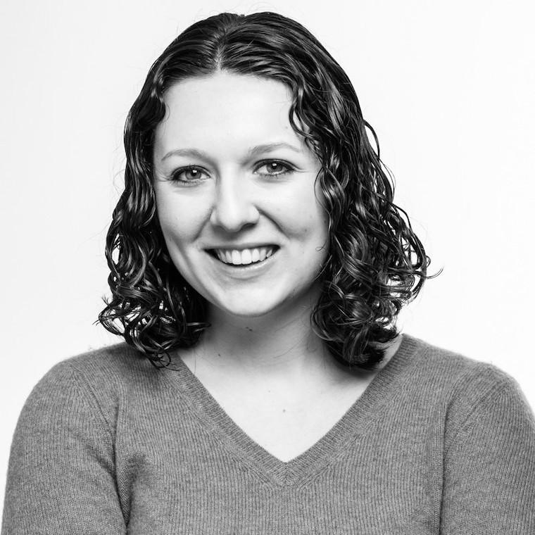 Black and white headshot of Emma Eisenberg.