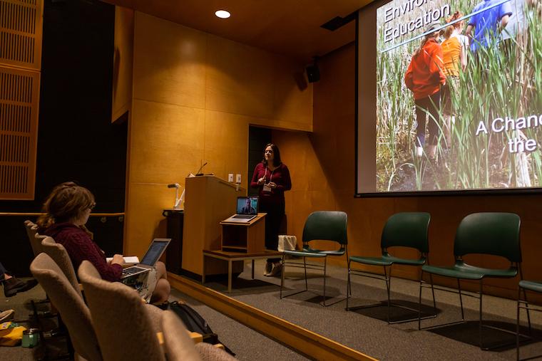 Picture of woman presenting slideshow
