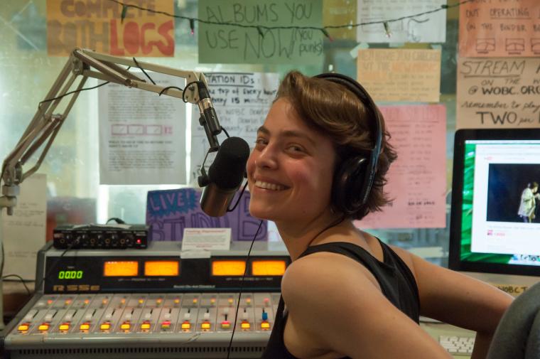 Rebecca at the microphone and sound console.