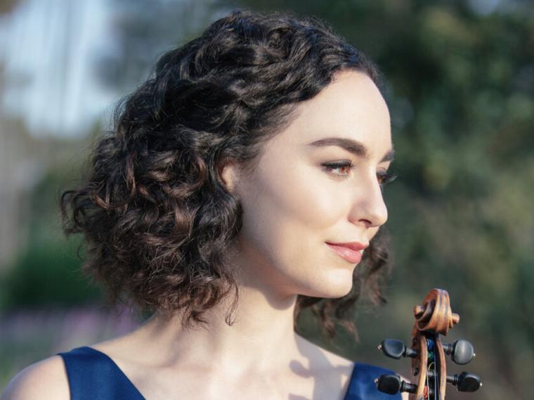 violin faculty member Francesca dePasquale holding her violin.