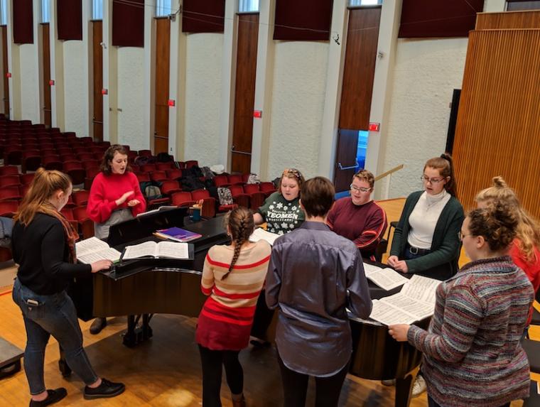 Oberlin College Student Olivia Fink leads a choir sectional in Warner Concert Hall