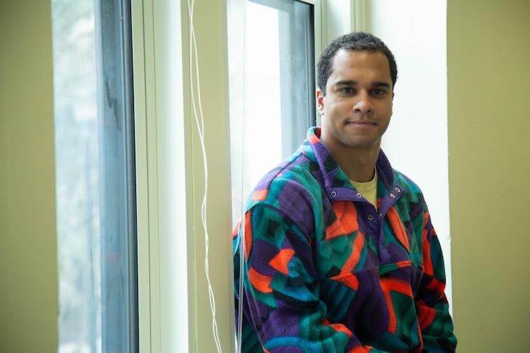 Picture of man sitting by a window