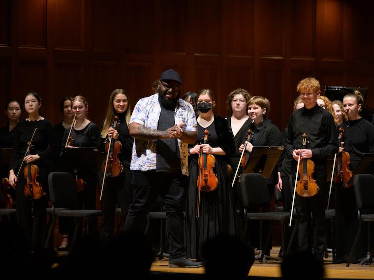 Faculty composer Michael Frazier receives ovation for a performance in Finney Chapel.