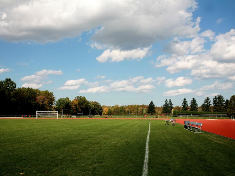 Fred Shults Field with a blue sky and clouds.