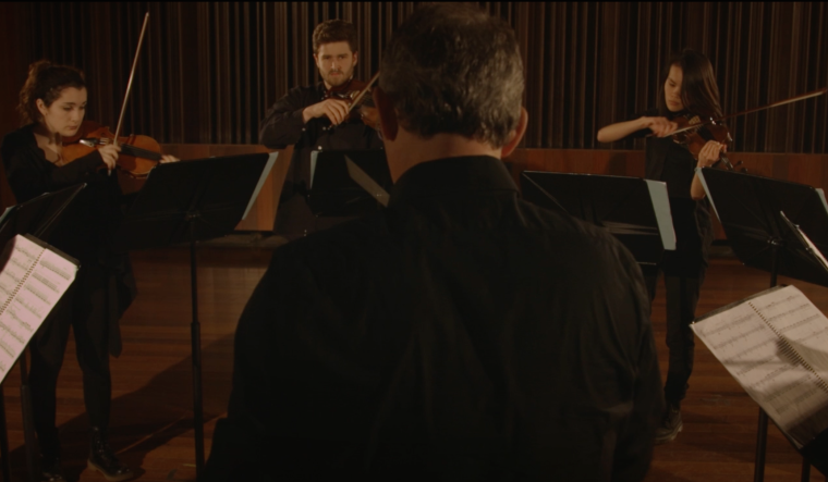 Professor of Conducting Timothy Weiss leads the Contemporary Music Ensemble (CME) in Andrew Norman’s work Gran Turismo for eight virtuoso violinists