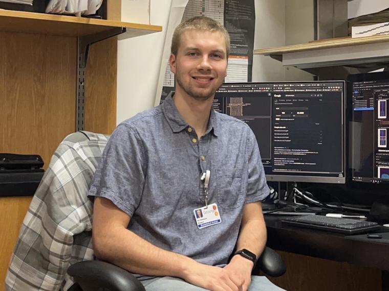 Ian Dinsmore sits at his desk at Geisinger.
