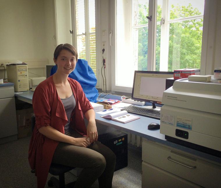 Emilie Lozier seated at a lab computer