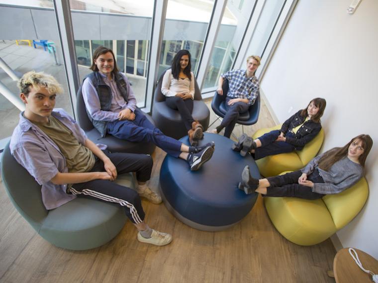 students sitting together in semi-circle.