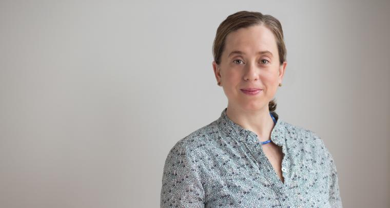 Julia Christensen poses in light blue flowered blouse.