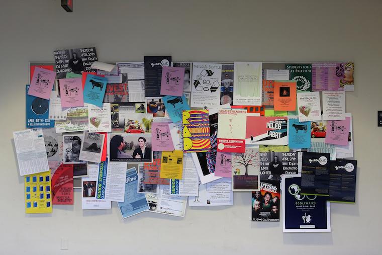 Picture of a board covered in posters