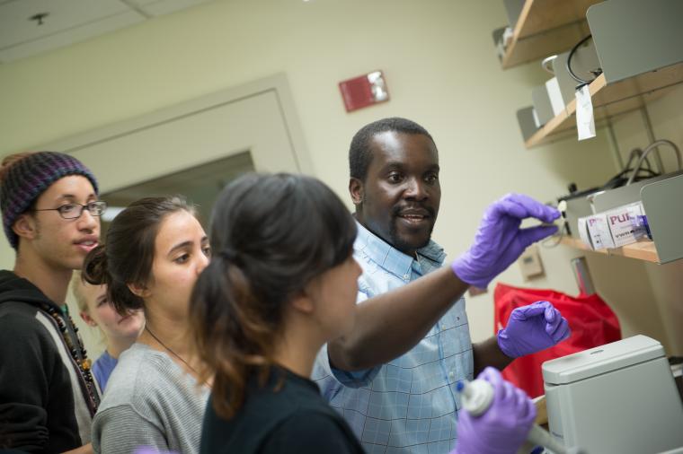 Students and a professor in a lab
