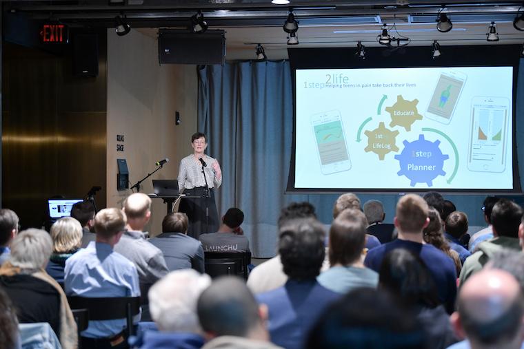 Photo of Nancy Darling presenting 1step2life at LaunchU