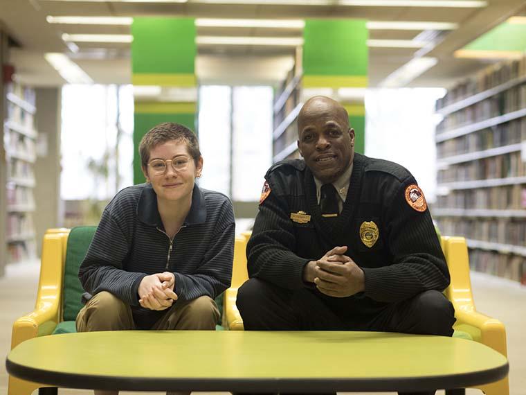 two people sitting side by side