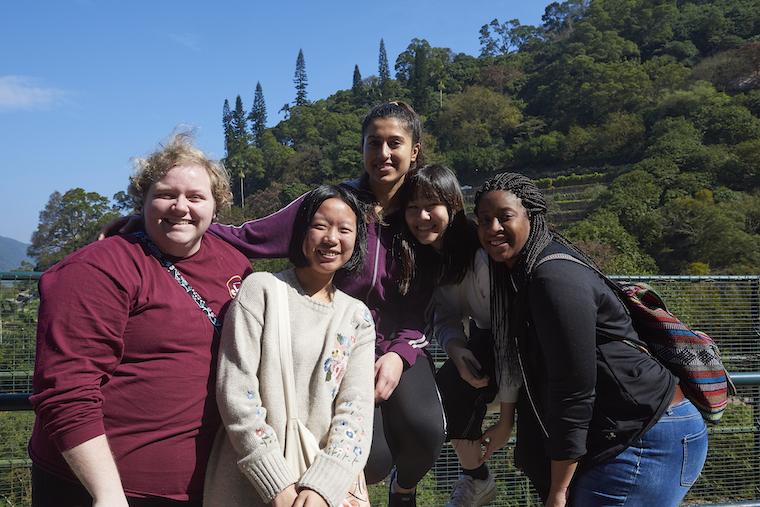 Five students pose at the Kadoori Farm and Botanic Garden in Hong Kong