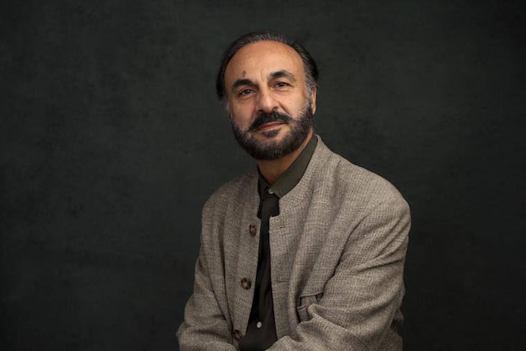 a professor sitting in a chair