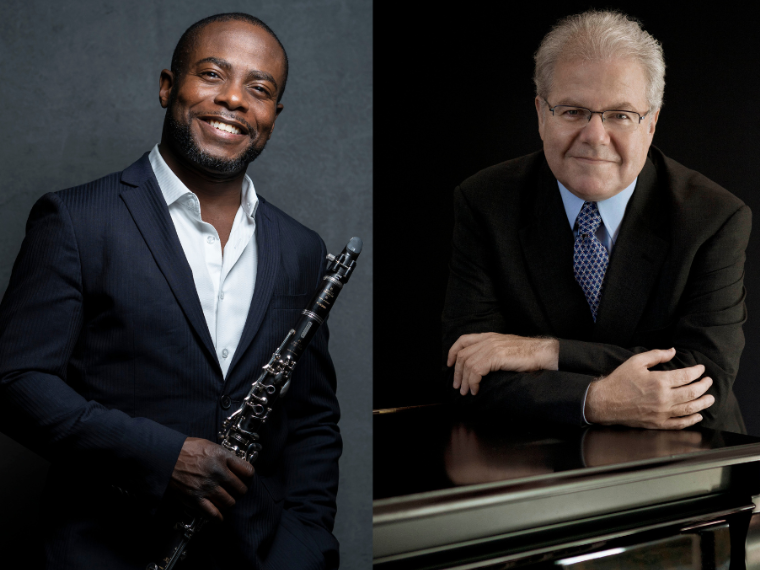 two men, one holding a clarinet and one leaning on a piano