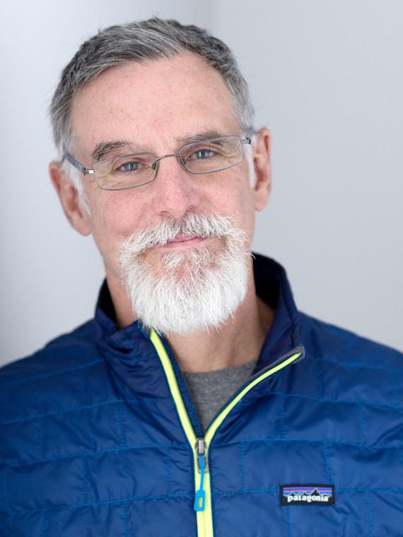 Man with a white goatee and glasses