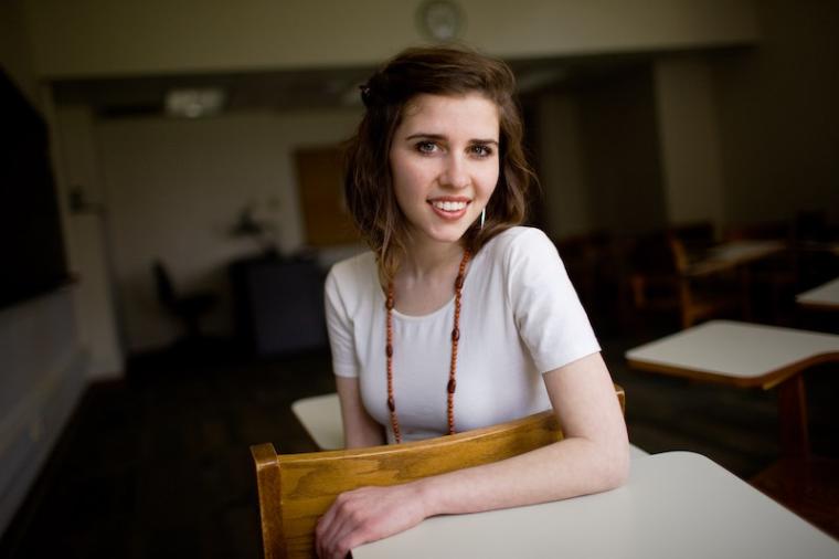 Meghan seated in a classroom