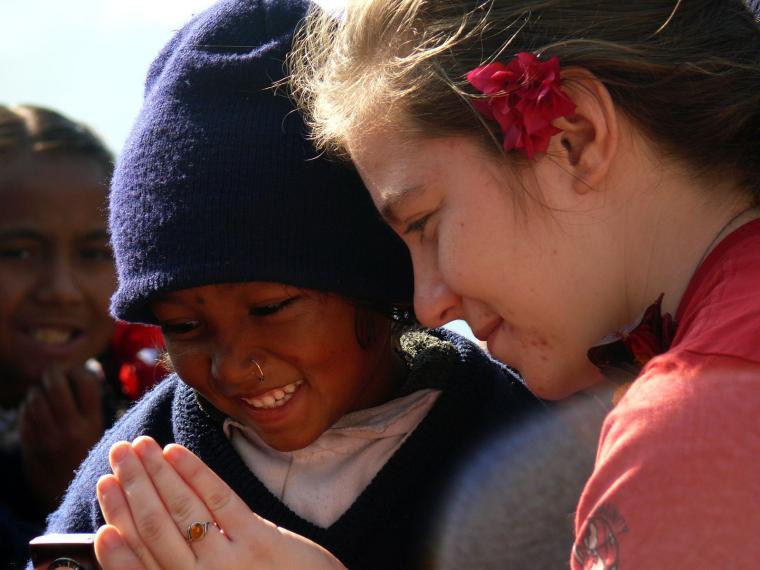 A young Nepali girl sees a photo for herself for the first time