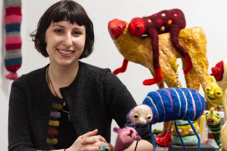 Headshot of Nina Josephson with her artwork