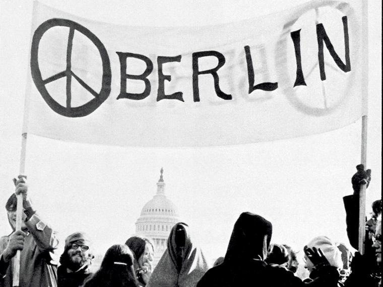 students standing under an Oberlin banner in Washington D.C.