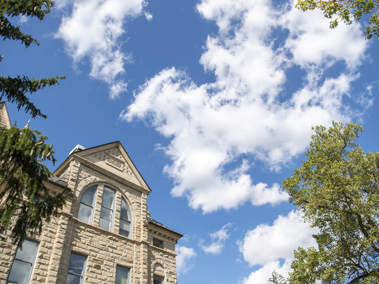 Peters Hall with a blue sky in the background.