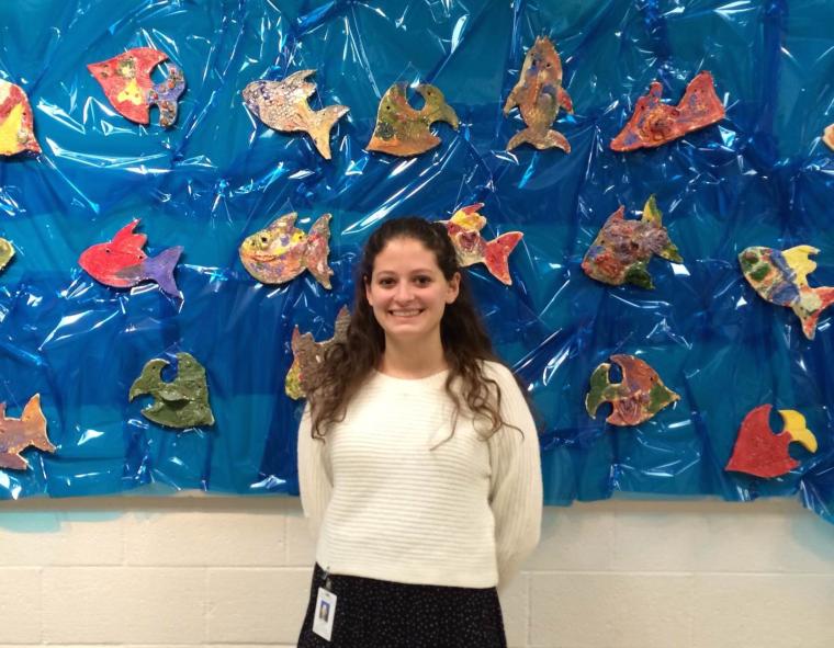 Rachel Marino ’13 posed with art 