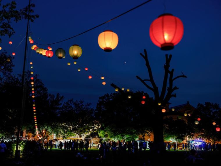 Colorful lanterns illuminating a nighttime celebration.